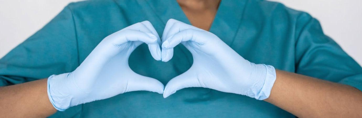 nurse with heart hands
